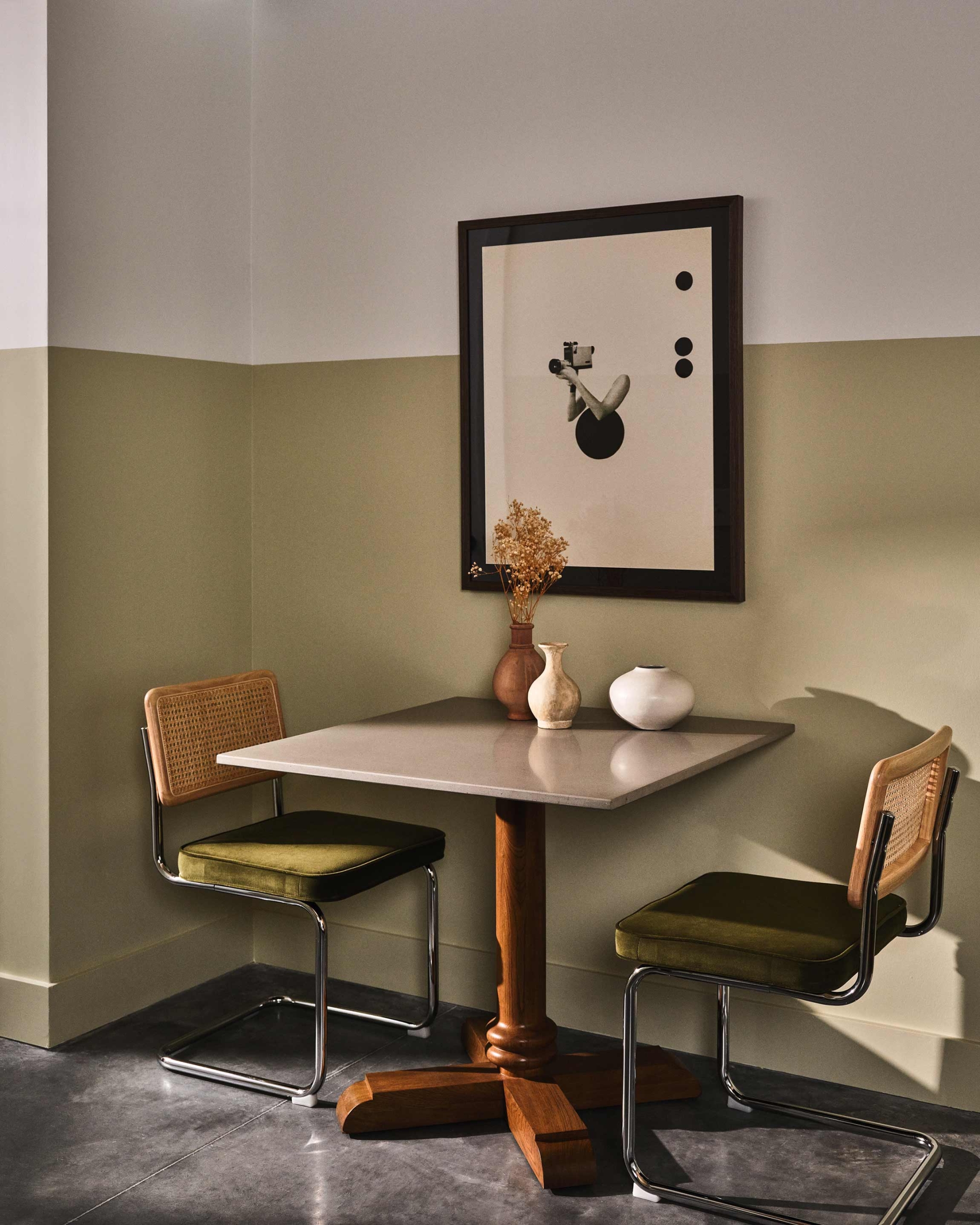 Dining seating area with abstract picture on the wall