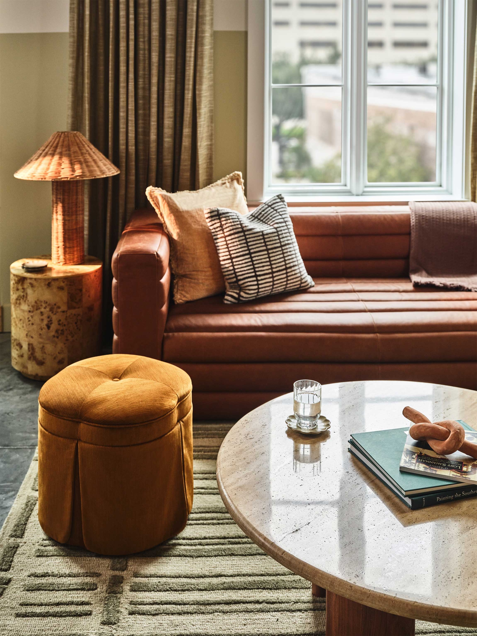 Living room seating with couch and ottoman